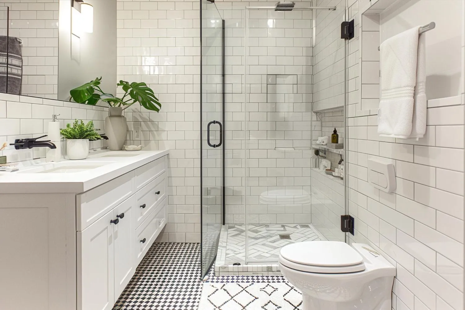 A bright, modern bathroom with a custom glass shower door.